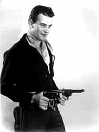 Vintage John Wayne photo with two pistols